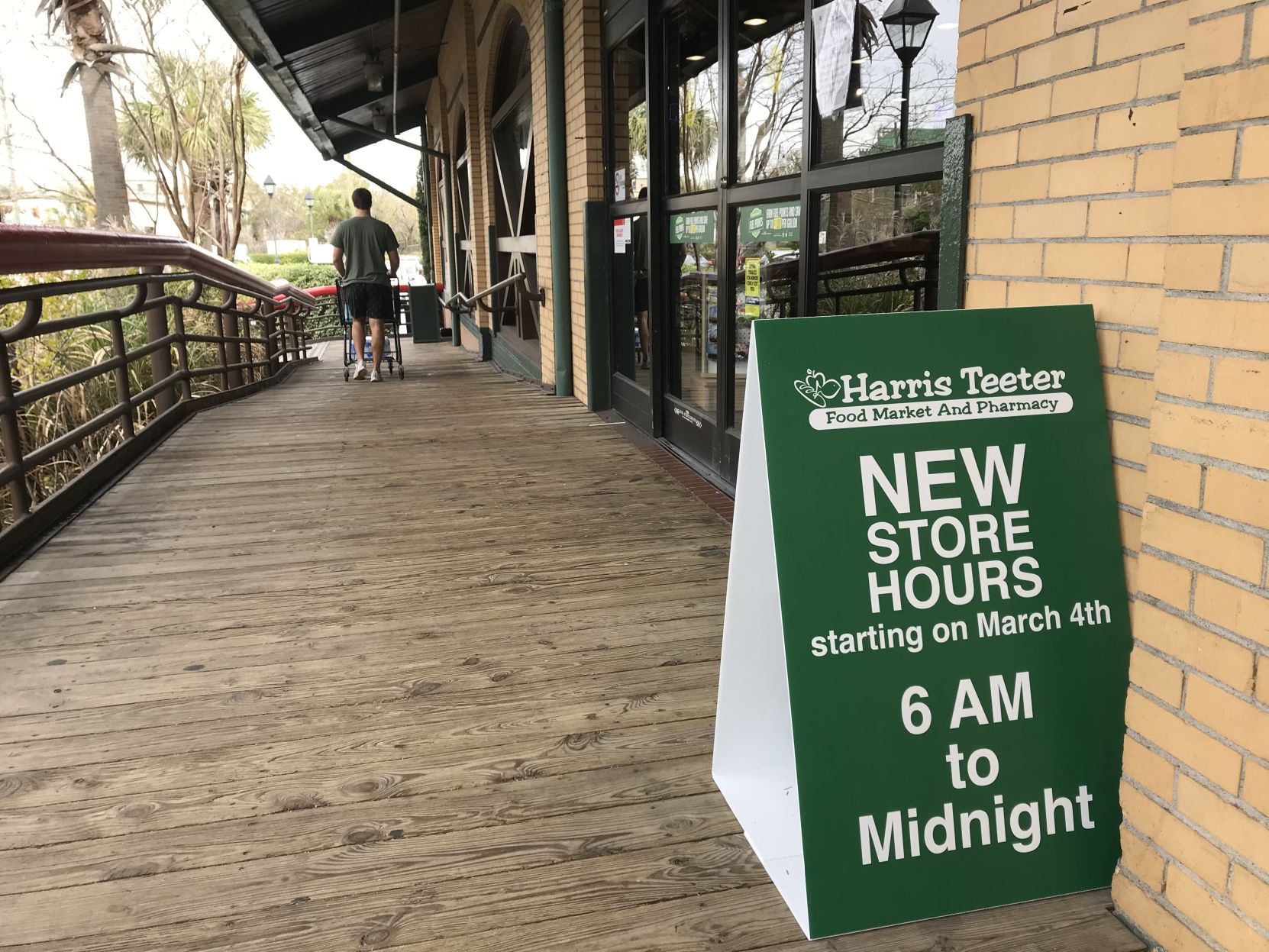 Harris Teeter placard displays new store hours